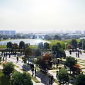 Urban Road Facilities With Pedestrian Paths Lush Trees Green Spaces And People Walking
