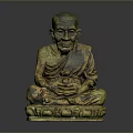 Ancient Bronze Statue of Sitting Man With Hands Clasped in Traditional Pose