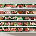 Assorted Meat Products Displayed on Supermarket Shelves with Green and Red Packages