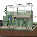 Green Container Café With Two Story Structure Outdoor Terrace And Lush Greenery