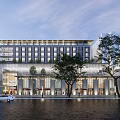 Modern Multi Storey Building With Glass Windows Street Trees And Parked Car At Evening