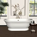 White Freestanding Bathtub With Brass Faucet Beside Window Small Table Palm Plant And Decorative Items
