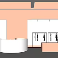Modern Clothing Store Interior with Peach-Colored Walls White Counter Clothes on Hangers and Spotlights