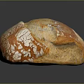 Freshly Baked Golden Crust Loaf of Bread with Flour Dusted Surface