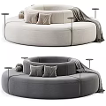 Curved Sectional Sofa In Beige And Gray With Pillows Side Tables And Throw Blanket