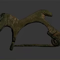 Ancient Bronze Dog Shaped Harness Fitting With Carved Details And Rustic Patina