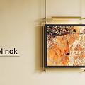 Botanical Painting with Golden Frame Featuring Branches on Orange Background Hanging on Beige Wall