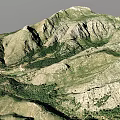 Scenic Mountain Landscape With Rolling Peaks Rocky Surfaces And Green Vegetation