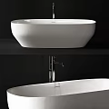 Modern White Freestanding Bathtub With Chrome Faucet And Sleek Minimalist Design