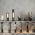 Stylish Modern Outdoor Lights With Various Pillar Designs Showcased On Marble Surface