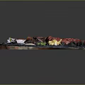 Assorted Grilled Meat Platter With Fresh Lettuce Onion Slices And Dipping Sauce On Slate Plate
