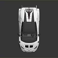 White Sports Car With Black Roof Rear Spoiler Sharp Lines And Race Inspired Aerodynamic Design