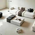 Modern Minimalist Sofa and Coffee Table Set with White Upholstery Black Pillows and Beige Carpet