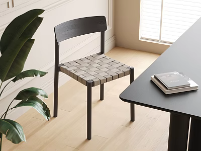 Modern Black Dining Chair With Woven Seat Next To Black Table And Green Plant 3d model