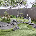 Rockery Stones In Traditional Japanese Garden With Lush Grass Stone Paths And Cherry Blossoms