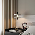 Modern Bedroom Interior With Pendent Lamp Gray Headboard Nightstand Candles And Headphones