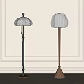 Two Modern Floor Lamps With Black Brown Poles And White Fabric Shades Against Paneled Wall