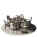 Modern Round Dining Table Set With Upholstered Chairs And Decorative Vase On Area Rug
