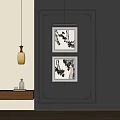 Abstract Ink Wash Paintings In Decorative Frames Hanging On Dark Wall For Interior Decor
