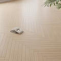 Light Colored Herringbone Pattern Wooden Flooring With Natural Light And Palm Leaves