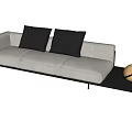 Stylish Light Gray Three-Seater Sofa With Black Cushions And Spherical Decor On Side Table