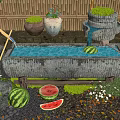Stone Trough Water Feature With Watermelons Potted Plants And Bamboo Fence