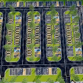Aerial View Of Parking Lot With Neatly Arranged Spaces Trees And Driveways