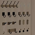 Various Decorative Wall Hooks On Wooden Board With Black Brown And Gold Designs