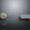 Wooden Stone Sphere and Square Slab with Textured Surface and Reflection on Gray Background