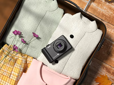 Open Suitcase Packed With Colorful Clothes Purple Flowers And Black Camera On Wooden Floor 3d model