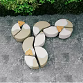 Modern Outdoor Chairs With Curved Design On Gray Stone Floor And Lush Greenery Backdrop
