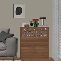 Decorative Figurine Set On Wooden Cabinet With Table Lamp Books And Small Plant