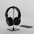 Black Over Ear Headphones On Stand With Smart Phone 3d model