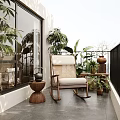 Cozy Balcony Relaxation Area With Rocking Chair Potted Plants And Terracotta Decor