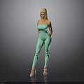 Blonde Woman in Green Jumpsuit Standing with High Heels on Gray Background