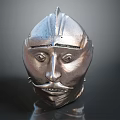 Ancient Metal Weapon Helmet with Shiny Silver Surface and Detailed Facial Features