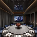 Modern Luxury Private Room With Round Dining Table Blue Seats Black Walls Orange SASEN Sign