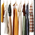 Fashionable Clothes Displayed on Racks with Bags Shoes and Luggage