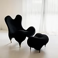Unique Black Bean Bag Chair With Matching Ottoman In Bright Modern Room