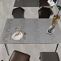 Dining Table Set With Blue Houndstooth Tablecloth Golden Plates Wine Glass And Brown Chairs