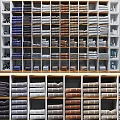 Bathroom Cabinet Rack With Neatly Stacked Colorful Towels And Storage Shelves