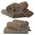 Bathroom With Soft Rolled And Folded Brown Towels Neatly Arranged