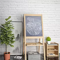 Easel Holding Apple Shaped Painting With Musical Instruments And Art Supplies Near White Brick Wall