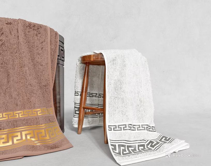 Brown And White Towels Featuring Greek Key Pattern Rolled And Draped On Stool 3d model 