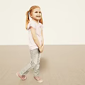 Little Girl with Pigtail Wearing Pink T-shirt Gray Pants and Pink Shoes on Light Background