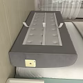 Gray Diamond Tufted Headboard Design With Side Pocket Golden Smartphone Bed Pillows And Plant