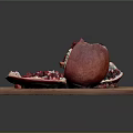 Fresh Sliced Pomegranate with Plump Red Arils on Wooden Cutting Board