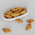 Freshly Baked Croissants in Wicker Basket with Scattered Croissants on White Background