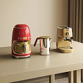 Red And Gold Coffee Makers With Silver Milk Frother On Countertop Home Appliances