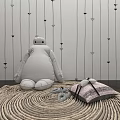 Cute White Stuffed Doll On Woven Rug With Striped Pink Pillows Against Arrow Patterned Wall